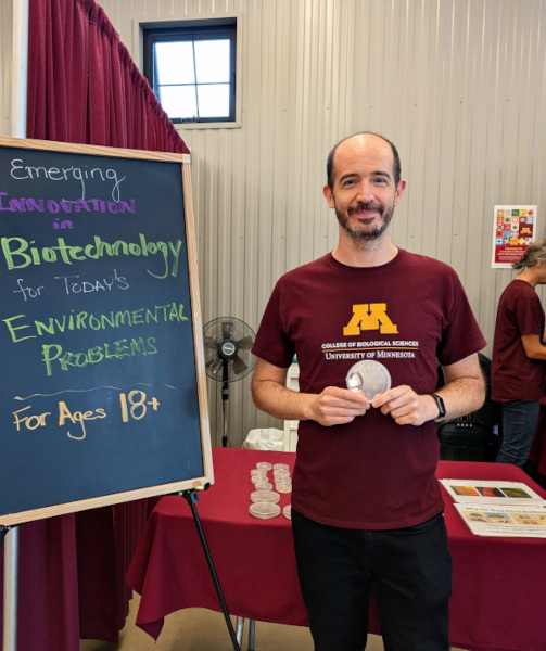 Francois Gaascht holding a petri dish at the Minnesota State Fair in 2025